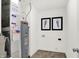 Utility room features washer/dryer hookups, water heater, and modern decor at 4424 Mendocino Blvd, Indianapolis, IN 46239