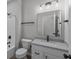 Bathroom with a shower-tub combination, toilet, vanity, mirror, and dark accents at 5040 Carmine St, Brownsburg, IN 46112