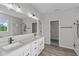 Bathroom featuring a double vanity, framed mirrors, modern fixtures and a separate shower at 5040 Carmine St, Brownsburg, IN 46112