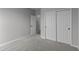 Carpeted bedroom with a closet and an open doorway at 5040 Carmine St, Brownsburg, IN 46112
