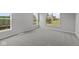 Bright bedroom with neutral carpeting, light gray walls and an abundance of natural light from large windows at 5040 Carmine St, Brownsburg, IN 46112