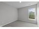 This bedroom offers carpeted floors and a large window for plenty of natural light at 5040 Carmine St, Brownsburg, IN 46112