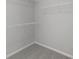 Walk-in closet featuring carpet and wire shelving, offering ample storage space at 5040 Carmine St, Brownsburg, IN 46112