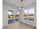 Bright dining area includes a sliding door to the patio and two large windows for natural light at 5040 Carmine St, Brownsburg, IN 46112