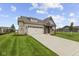 Charming single-story home with brick facade, attached garage, and manicured lawn at 5040 Carmine St, Brownsburg, IN 46112