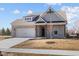 Attractive single-Gathering house featuring brick facade, manicured lawn, and an attached two-car garage at 5040 Carmine St, Brownsburg, IN 46112