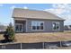 Rear exterior shows covered patio and large windows providing natural light at 5040 Carmine St, Brownsburg, IN 46112