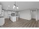 Bright kitchen features a central island, stainless steel appliances, and modern lighting fixtures at 5040 Carmine St, Brownsburg, IN 46112