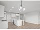 Well-lit kitchen showcases an island with a sink, stainless steel appliances, and modern fixtures at 5040 Carmine St, Brownsburg, IN 46112