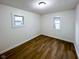 Bedroom with two windows and wood flooring at 5103 E St Clair St, Indianapolis, IN 46219