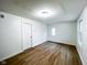 Bright bedroom with hardwood flooring, fresh paint, and natural light at 5103 E St Clair St, Indianapolis, IN 46219