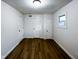 Bedroom features wood floors, white walls, two closets and a window at 5103 E St Clair St, Indianapolis, IN 46219