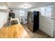 Kitchen features stainless steel refrigerator, butcher block counters, and a white door to the backyard at 5103 E St Clair St, Indianapolis, IN 46219