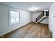 Bright living room with hardwood floors and natural light at 5103 E St Clair St, Indianapolis, IN 46219