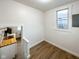Bright room showcasing hardwood floors, fresh paint, and access to the kitchen area at 5103 E St Clair St, Indianapolis, IN 46219