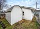 A white shed in the back of the home with dead leaves in the yard at 5103 E St Clair St, Indianapolis, IN 46219