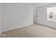 Neutral bedroom featuring carpet, a window, and white walls at 5119 Rolling Meadow Blvd, Indianapolis, IN 46237