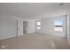 Bright, spacious bedroom features neutral carpeting and large windows providing ample light at 5119 Rolling Meadow Blvd, Indianapolis, IN 46237