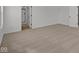 A clean bedroom with carpeting and ensuite bath offers comfort and convenience at 5119 Rolling Meadow Blvd, Indianapolis, IN 46237