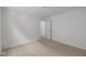 Neutral bedroom featuring carpet, a door to another room, and white walls at 5119 Rolling Meadow Blvd, Indianapolis, IN 46237