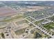 New home construction featuring landscaped streets and picturesque ponds, with rural views in the distance at 5146 Cartland Dr, Indianapolis, IN 46239