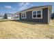 Home's gray exterior featuring newly installed lawn with spacious backyard at 5146 Cartland Dr, Indianapolis, IN 46239