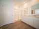 Bathroom featuring double vanity, a glass-enclosed shower, and modern fixtures at 5146 Cartland Dr, Indianapolis, IN 46239