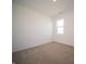 Comfortable bedroom featuring neutral carpeting, a large window, and white walls at 5146 Cartland Dr, Indianapolis, IN 46239