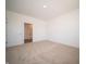 Empty bedroom showing carpeting, neutral walls, and closet with storage at 5146 Cartland Dr, Indianapolis, IN 46239