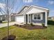 Stylish home boasting a well-manicured lawn, light gray siding, and an attached two-car garage at 5146 Cartland Dr, Indianapolis, IN 46239