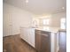 Modern kitchen featuring stainless appliances, an island with seating and undermount sink, and pendant lighting at 5146 Cartland Dr, Indianapolis, IN 46239
