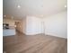 Spacious living area with wood-style flooring leading to the kitchen at 5146 Cartland Dr, Indianapolis, IN 46239