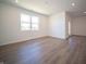 Living room with a large window and wood-style floors at 5146 Cartland Dr, Indianapolis, IN 46239