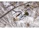 Bird's-eye view of the property, highlighting the home's layout and spacious lot surrounded by snow-covered trees at 6842 Cardinal Dr, McCordsville, IN 46055