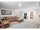 Basement with gray carpeting, large brown sectional, and an entertainment system at 6842 Cardinal Dr, McCordsville, IN 46055