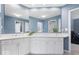 Spacious bathroom features a dual sink vanity with quartz countertops and stylish blue walls at 6842 Cardinal Dr, McCordsville, IN 46055