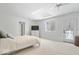 Bright bedroom featuring a skylight, access to the backyard, and neutral walls at 6842 Cardinal Dr, McCordsville, IN 46055