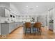 A well-lit kitchen features a spacious island with bar stool seating at 6842 Cardinal Dr, McCordsville, IN 46055