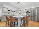Modern kitchen with center island, stainless appliances, and hardwood floors at 6842 Cardinal Dr, McCordsville, IN 46055