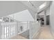 Bright landing with white railing, built-in bookshelves, and natural light from skylights at 6842 Cardinal Dr, McCordsville, IN 46055