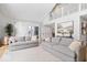 Open living room featuring two couches, hard wood floors and bright lighting at 6842 Cardinal Dr, McCordsville, IN 46055