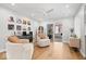 Cozy living room with modern furnishings, hardwood floors, and sliding glass doors to outdoor living space at 6842 Cardinal Dr, McCordsville, IN 46055