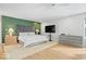 This large main bedroom features hardwood floors, lots of natural light, and modern furniture and fixtures at 6842 Cardinal Dr, McCordsville, IN 46055