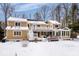 Rear exterior showcases a spacious deck, sunroom addition, and a snowy backyard, perfect for outdoor enjoyment at 6842 Cardinal Dr, McCordsville, IN 46055