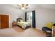 Bedroom with a sloped ceiling, dark curtains, and an abstract video game themed wall decor at 6865 Meadow View Dr, Lawrence, IN 46226