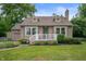 Charming home featuring a well-manicured lawn, neutral siding, and inviting front porch at 6865 Meadow View Dr, Lawrence, IN 46226