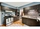 Galley-style kitchen with contrasting cabinets, stainless steel appliances at 6865 Meadow View Dr, Lawrence, IN 46226