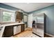 Kitchen featuring stainless steel appliances and contrasting cabinets at 6865 Meadow View Dr, Lawrence, IN 46226