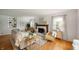 Bright living room featuring a fireplace, hardwood floors, and neutral decor at 6865 Meadow View Dr, Lawrence, IN 46226