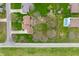 An aerial view shows a home with a large yard and a swimming pool in the backyard at 7018 W Anton Way, New Palestine, IN 46163